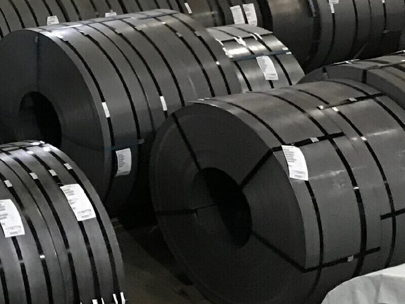 Four slitted hot rolled steel coils that are bound together with black bands.