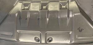 High strength low alloy steel stamped part showing imperfection.