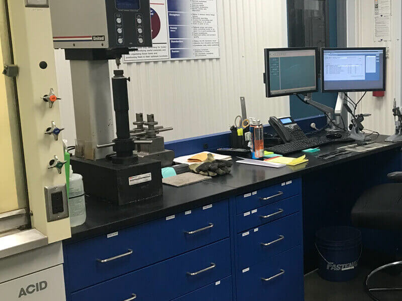 A blue and black desk with rockwall tester at worthington steel columbus labs